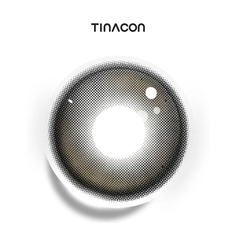 Sheer Black colored contact lenses exhibiting a semi-translucent ink gradient that blends seamlessly with the iris for an effortlessly authentic finish.