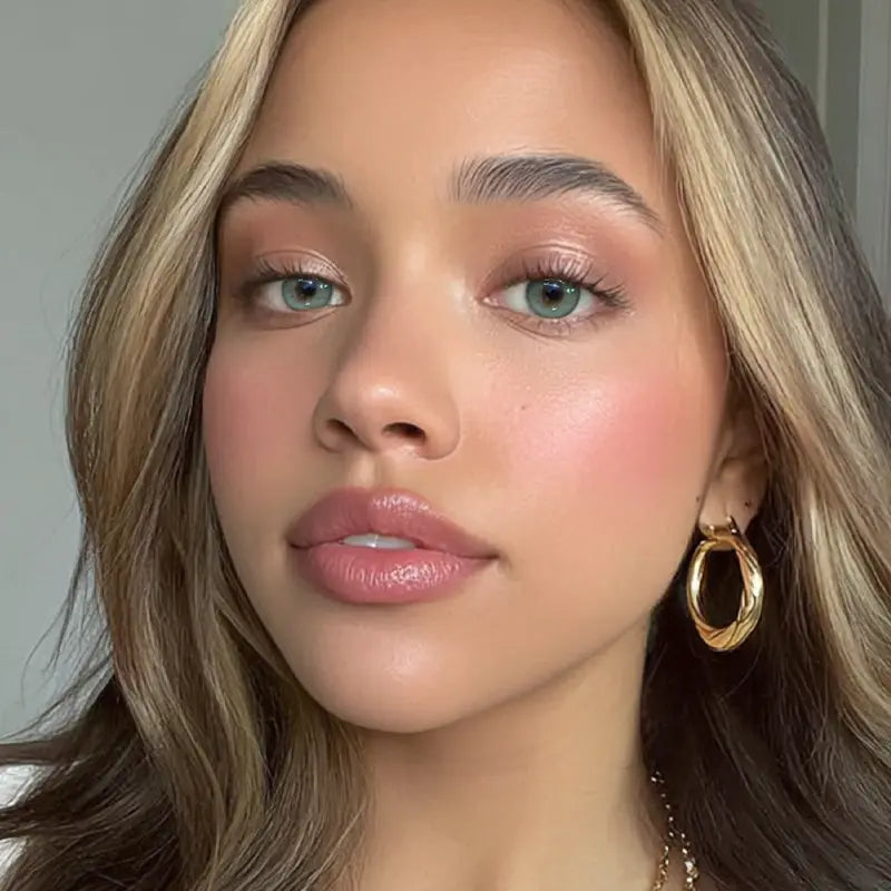 A portrait featuring Velvet Plum Gray colored contact lenses, designed to provide a spirited look for the modern trendsetter.