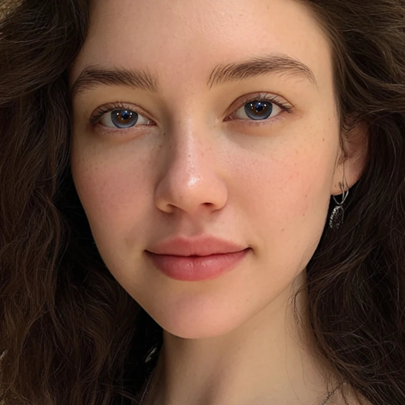 A captivating portrait featuring Wild Card Gray colored contact lenses, designed to catch the light and create a mesmerizing, stellar glow.