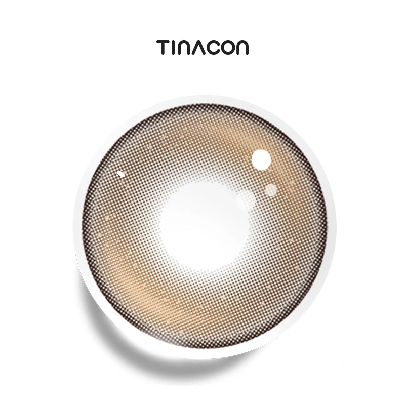 Front Row Brown colored contact lenses exhibiting a rich hazel base accented by two symmetrical light-catching zones for a glossy finish.