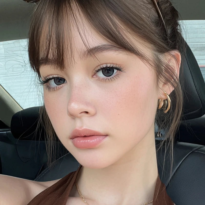 An portrait featuring Lost Toy Gray colored contact lenses, designed to provide a spirited and high-definition glow.