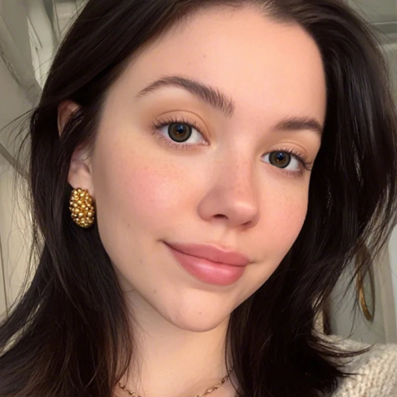 A portrait featuring High Gloss Brown colored contact lenses that add a polished, glass-like finish to the eyes.