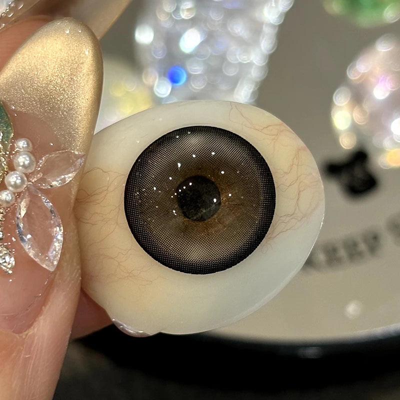 Gray colored contacts showcase a high-standard, bold pigment structure designed to enhance iris definition.