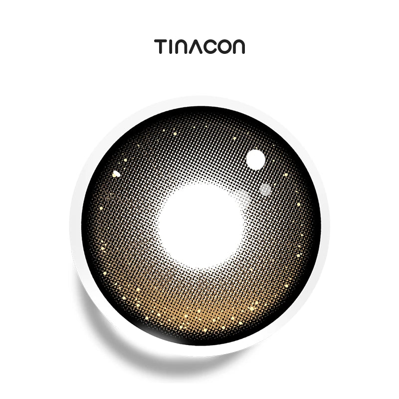 Cosmic Halo colored contact lenses showcasing a deep indigo base accented by a delicate, ethereal ring of luminous silver particles.