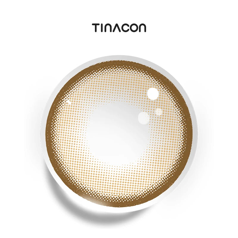 Citrus Brown colored contact lenses exhibiting a juicy tangerine core that seamlessly transitions into a soft perimeter.