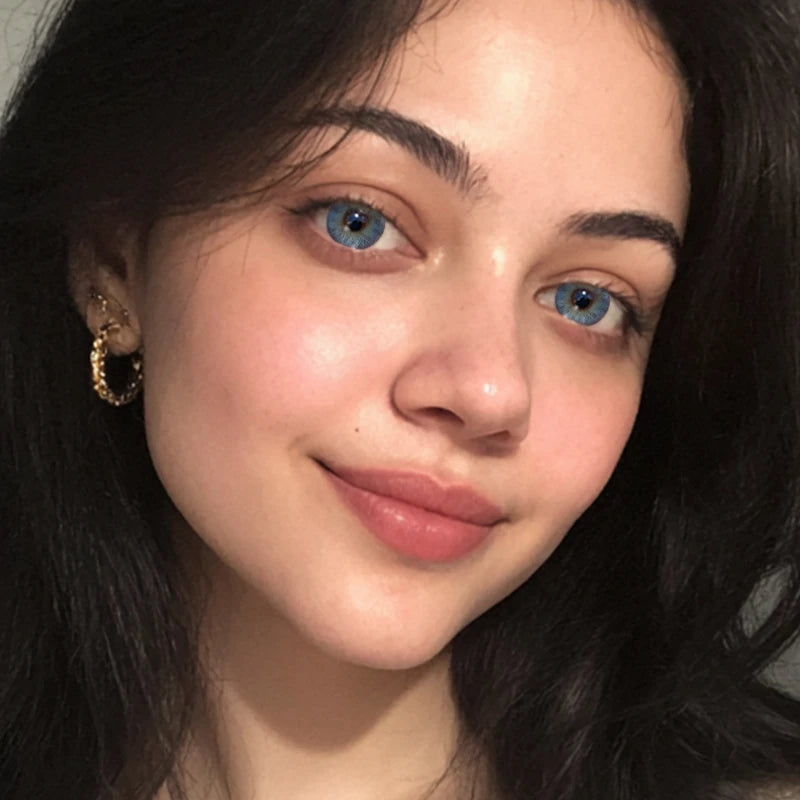 A high-impact, ethereal portrait featuring Tundra Blue colored contact lenses, delivering a cool and captivating gaze that feels both bold and otherworldly.